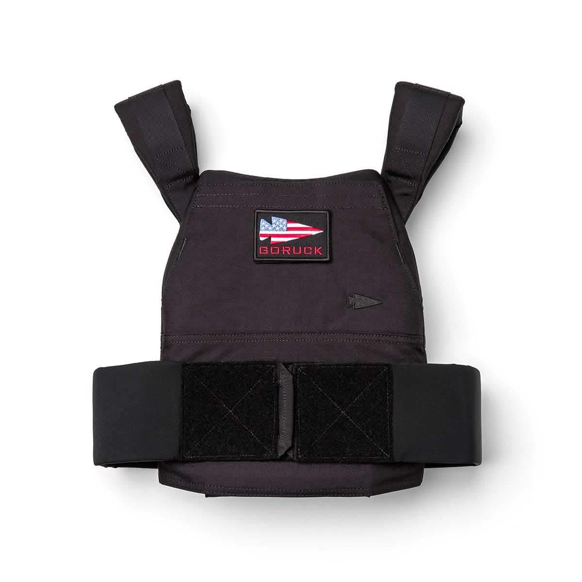 Black GORUCK weight vest for rucking with a red, white, and blue spearhead logo patch on the chest.