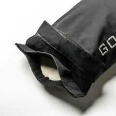 Close-up of a black glove with Velcro strap and soft fleece lining—ideal for gripping Simple Training Sandbags or other home gym equipment.